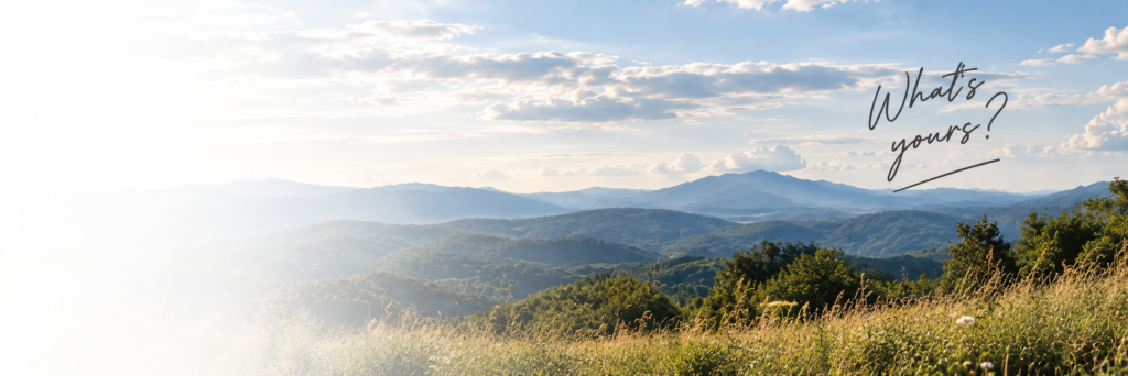 Wide-open mountain landscape with rolling green ridges and the handwritten words “What’s yours?” for FIG Unmuted.